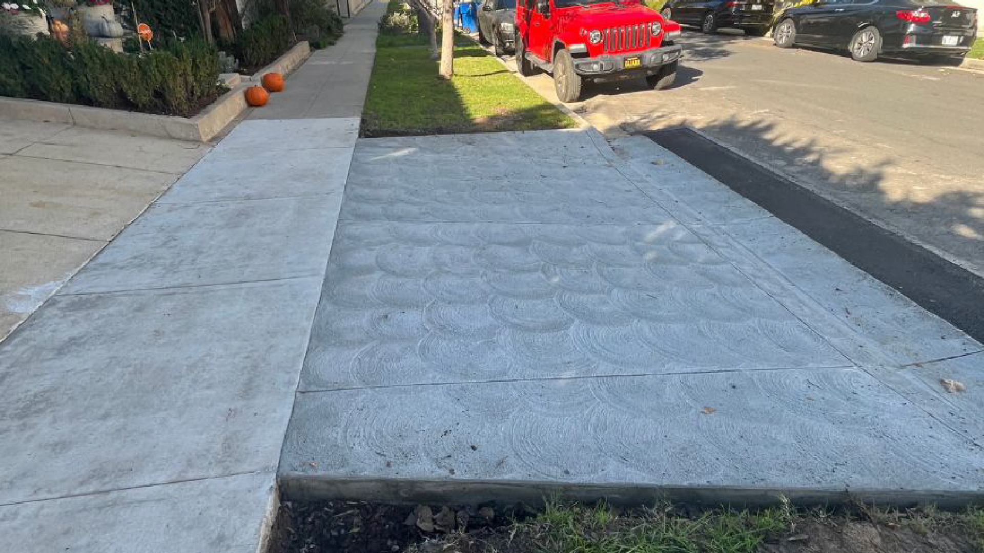 Professional sidewalk repair crew at work